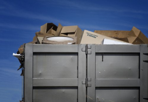 Workers sorting and collecting commercial rubbish containers