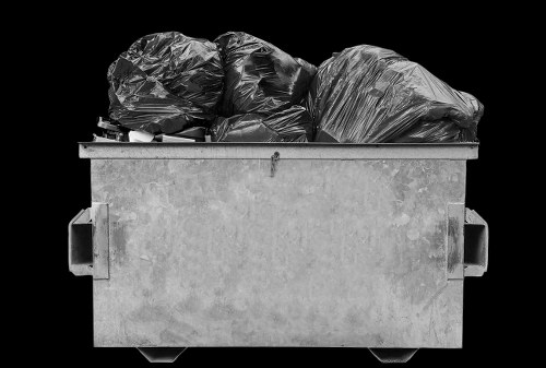 Staff wearing PPE conducting a safe waste handling task as part of training and compliance